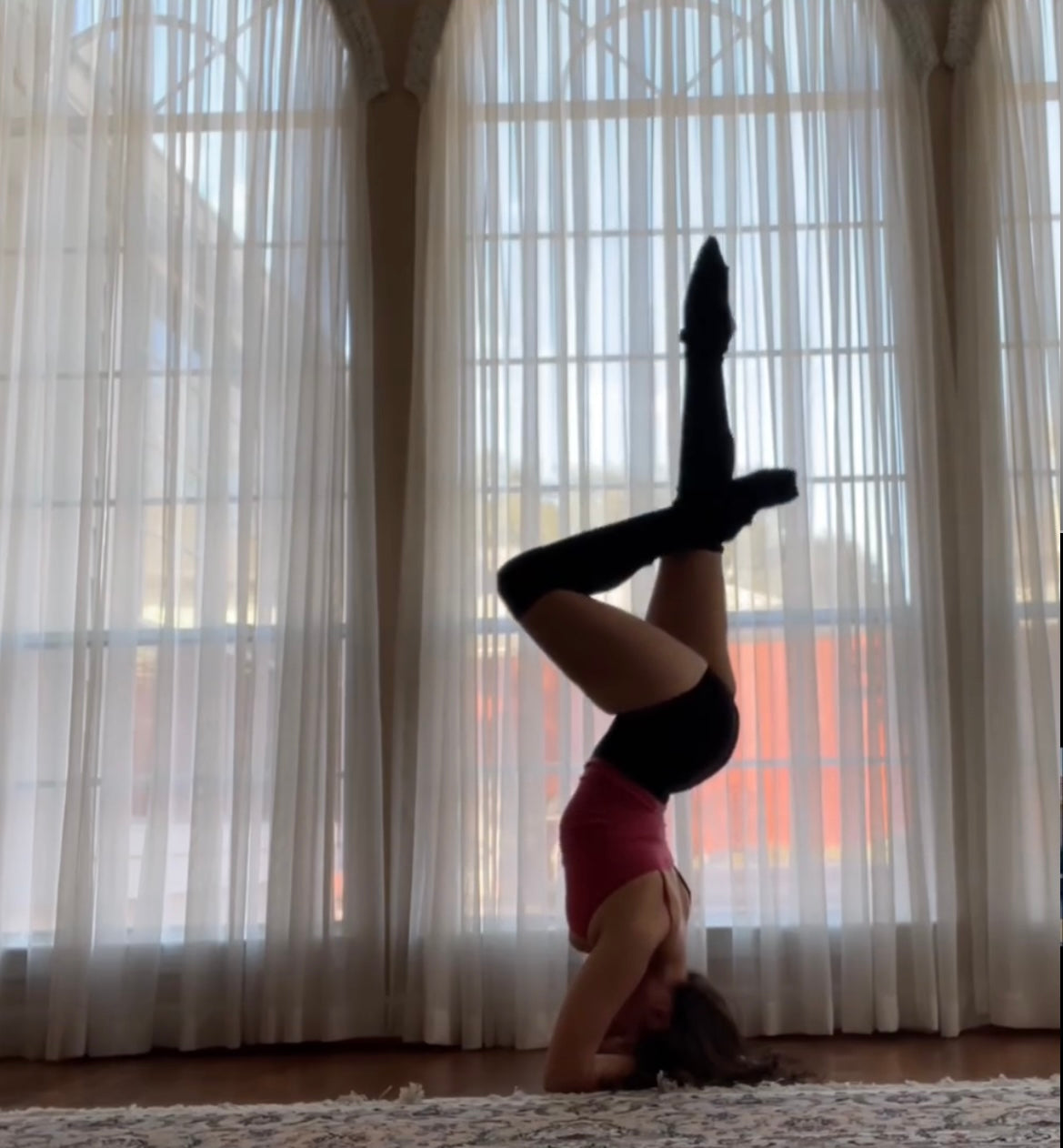  Lisa Alavi doing a headstand inversion yoga pose 